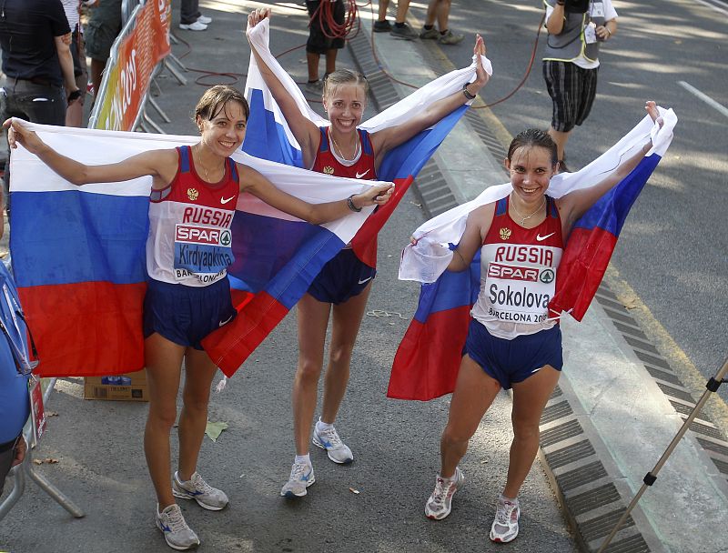Gold medallist Kaniskina of Russia celebrates with her compatriots silver medallist Kirdyapkina and bronze medallist Sokolova after women's 20km walk at European Athletics Championships in Barcelona