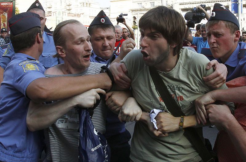 Russian policemen detain opposition party supporters during the unauthorized protest rally in Moscow