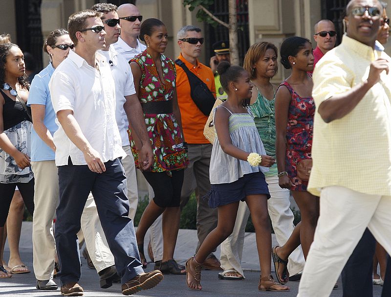 U.S. first lady Michelle Obama walks through the streets with her daughter Sasha during their vacation to the historic center of the southern Spanish town of Granada