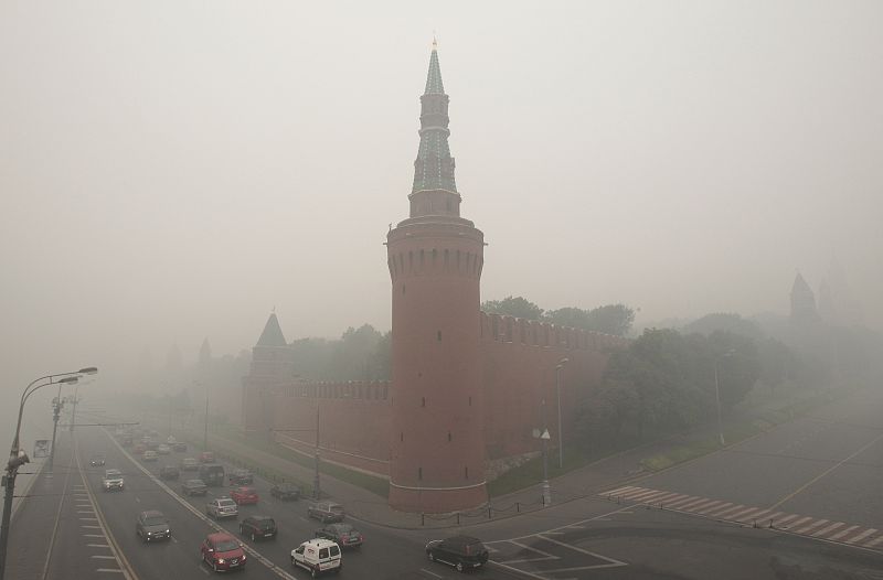 The Kremlin wall is seen through heavy smog, caused by peat fires in nearby forests, in Moscow