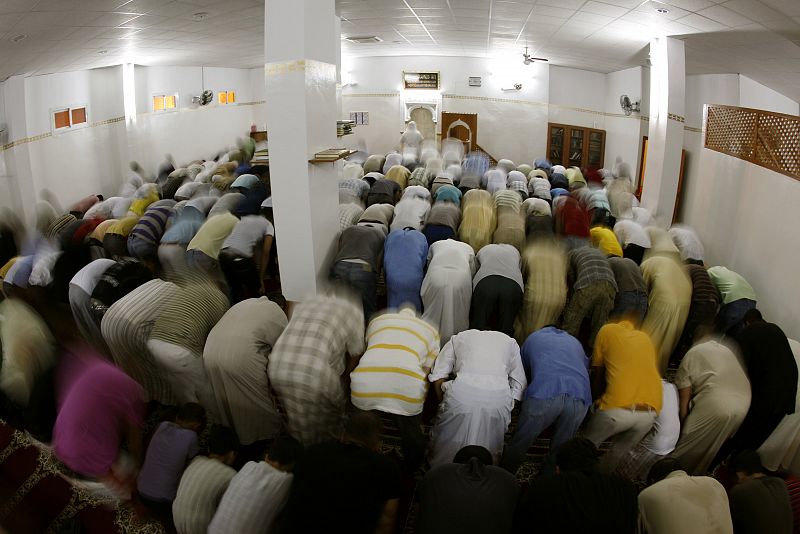 Muslims pray after breaking their fast on the first day of Ramadan at a mosque in the southern Spanish town of Estepona