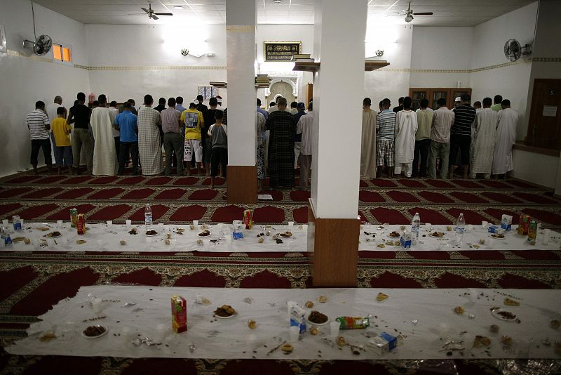 Muslims pray after breaking fast on the first day of Ramadan at a mosque in the southern Spanish town of Estepona