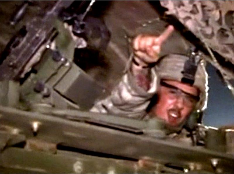 A U.S. soldier from the 1st Battalion, 116th Infantry Regiment, receives help from his fellow soldiers to unload luggage before he leaves Iraq for Kuwait from Tallil Air Base near Nassiriya