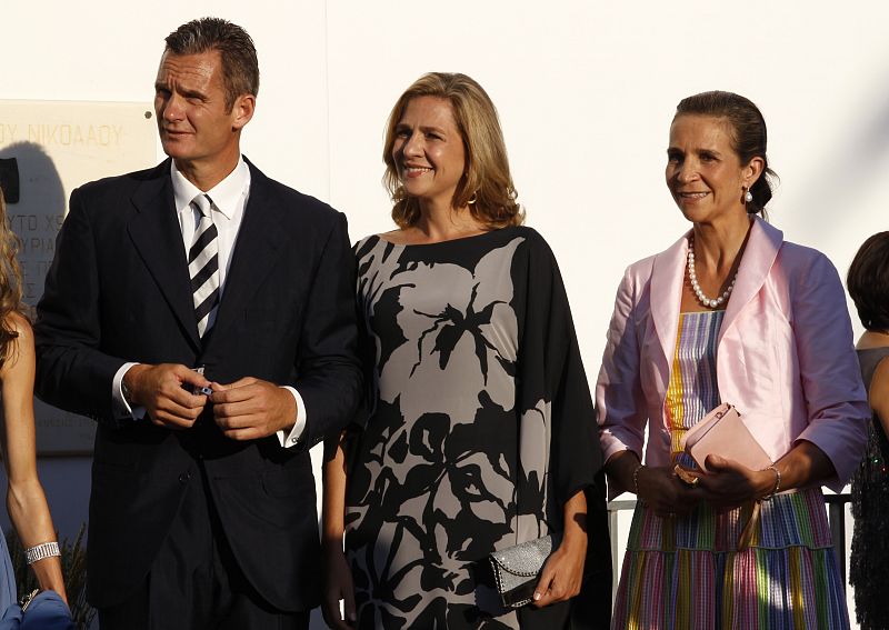 Spain's Inaki Urdangarin and his wife Infanta Cristina and the Infanta Elena arrive at Agios Nikolaos church to attend the wedding ceremony of Prince Nikolaos and Tatiana Blatnik on the island of Spetses