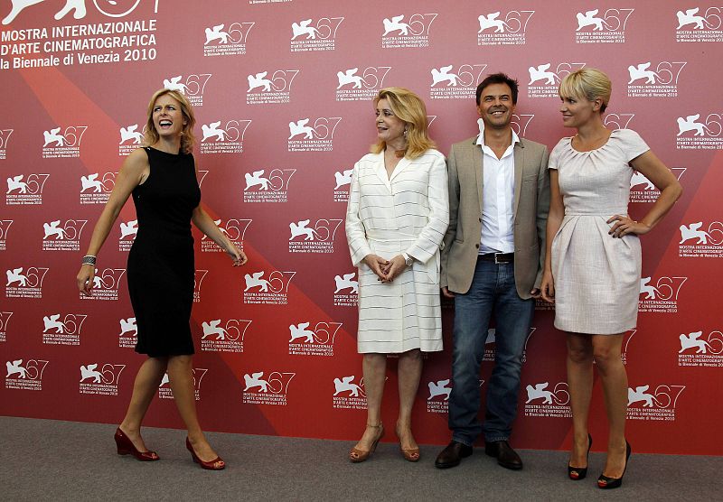 Ozon, director of in-competition film "Potiche", poses with actress Deneuve, Godreche and Viard during a photocall in Venice