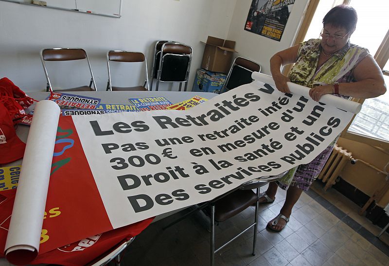 An union activist prepares placards and banners before a protest march in Marseille