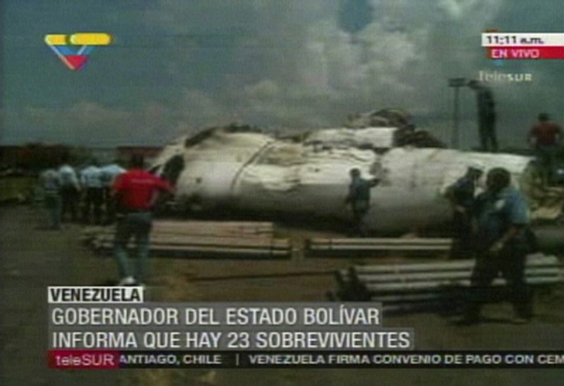 A video grab shows rescue workers at the site of an ATR-42 plane crash in Puerto Ordaz