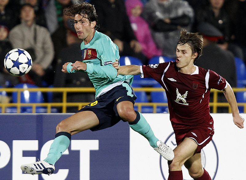 Barcelona's Maxwell challenges Rubin Kazan's Kaleshin during their Champions League Group D soccer match at Central stadium in Kazan