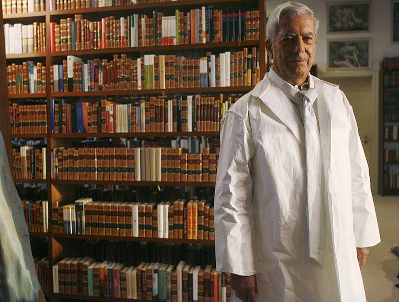 Peruvian writer Mario Vargas Llosa poses wearing a suit and a tie made of recycled paper during a recycling campaign in Lima