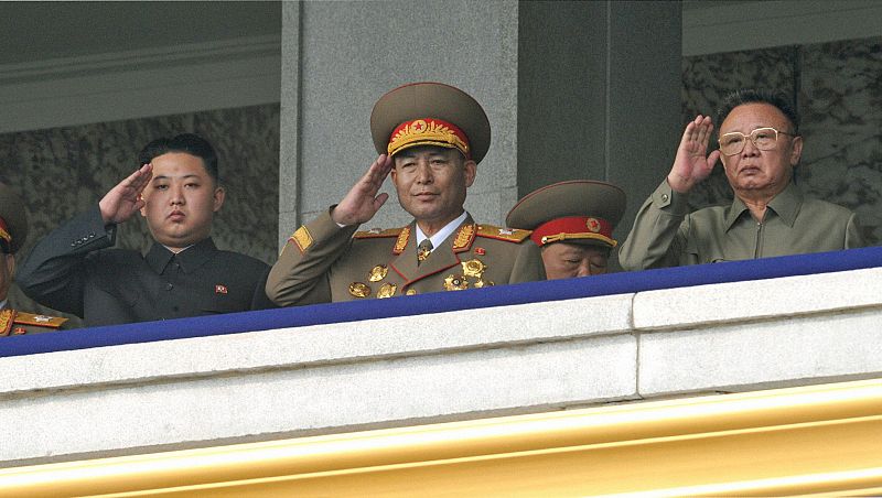 North Korean leader Kim Jong-il and his youngest son Kim Jong-un salute during a parade in Pyongyang
