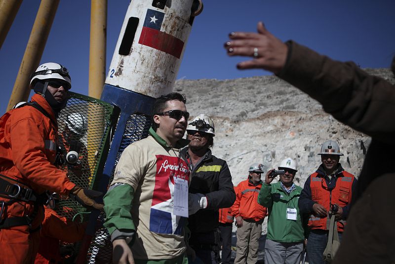 Miner Pena becomes the twelfth trapped miner to reach the surface in Copiapo