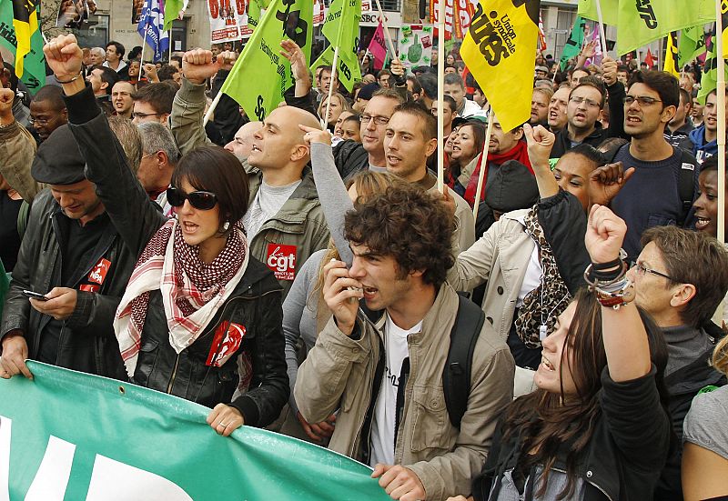 Private and public sector workers attend a demonstration over pension reform in Paris