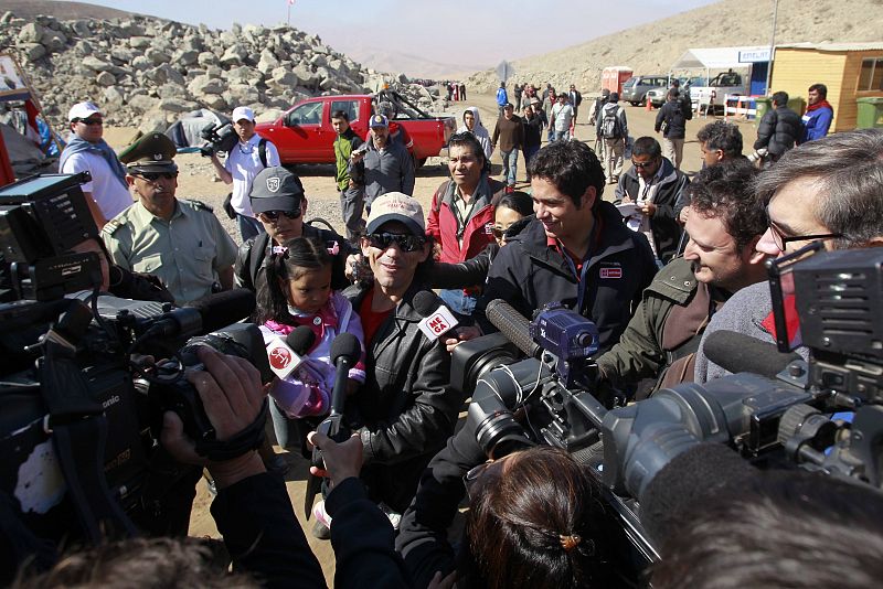 Rescued Chilean miner Claudio Yanez answers a question as he arrives at the San Jose mine