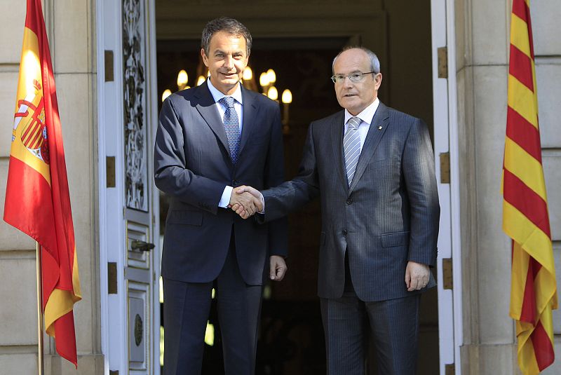 Catalonia's President Montilla shakes hands with Spain's Prime Minister Zapatero after his arrival at Moncloa palace in Madrid