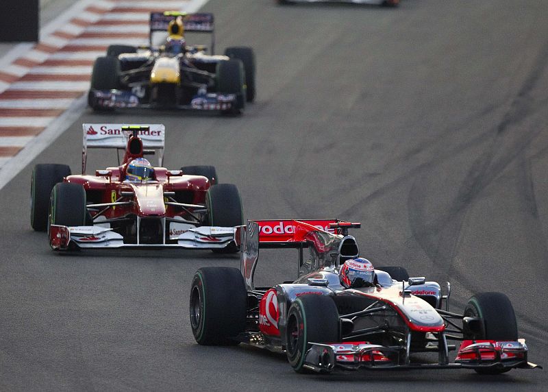 Button leads Alonso and Webber during the Abu Dhabi F1 Grand Prix at Yas Marina circuit in Abu Dhabi