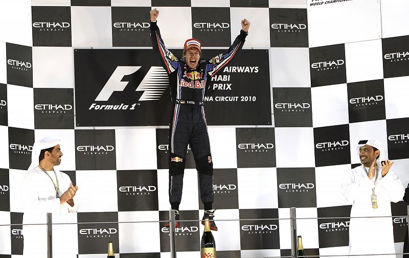 Red Bull Formula One driver Sebastian Vettel of Germany celebrates after winning the Abu Dhabi F1 Grand Prix