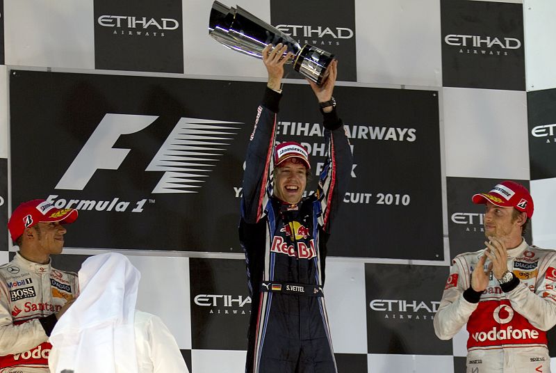 Red Bull Formula One driver Sebastian Vettel of Germany celebrates his championship and Grand Prix win on the podlium in Abu Dhabi