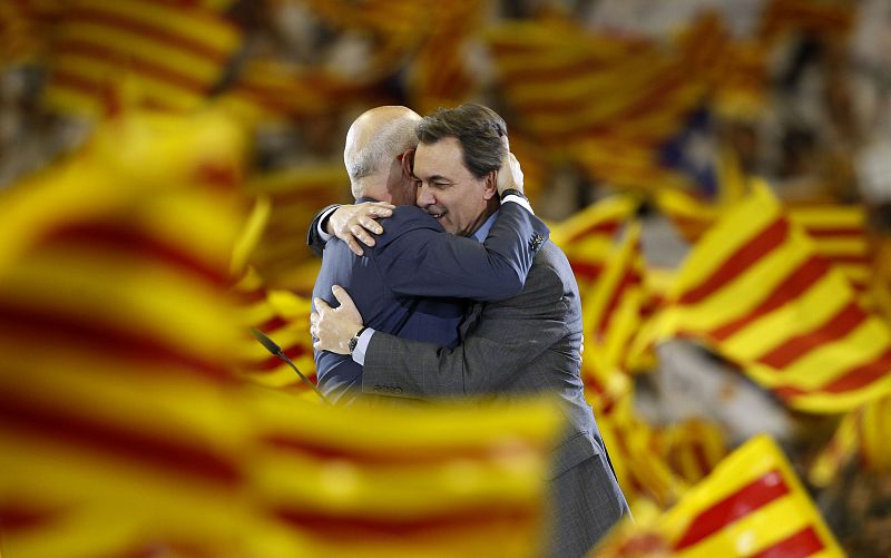 Artur Mas, leader of Convergencia i Unio (CIU) and candidate for the upcoming elections in Catalonia hugs party co-leader Josep Antoni Duran i Lleida during a meeting in Barcelona