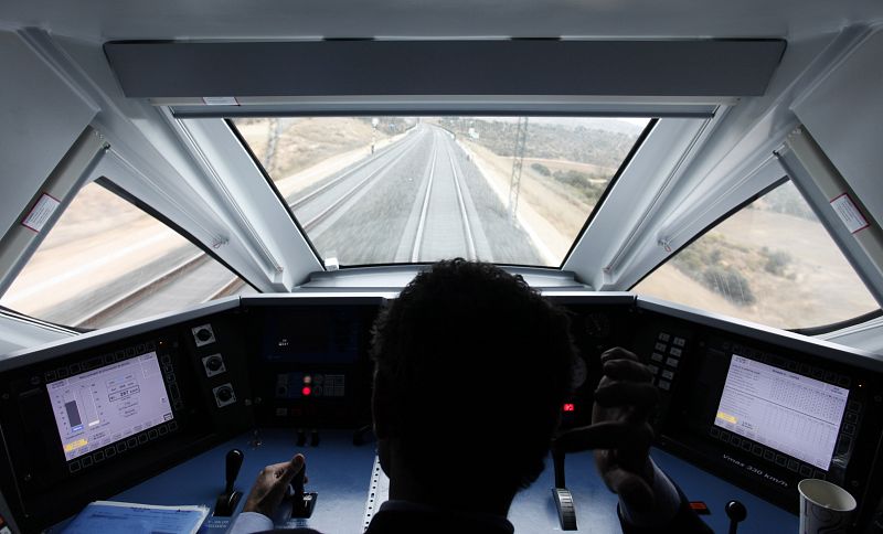 A driver operates the AVE Spanish High Speed train linking Madrid to Valencia during a press trip