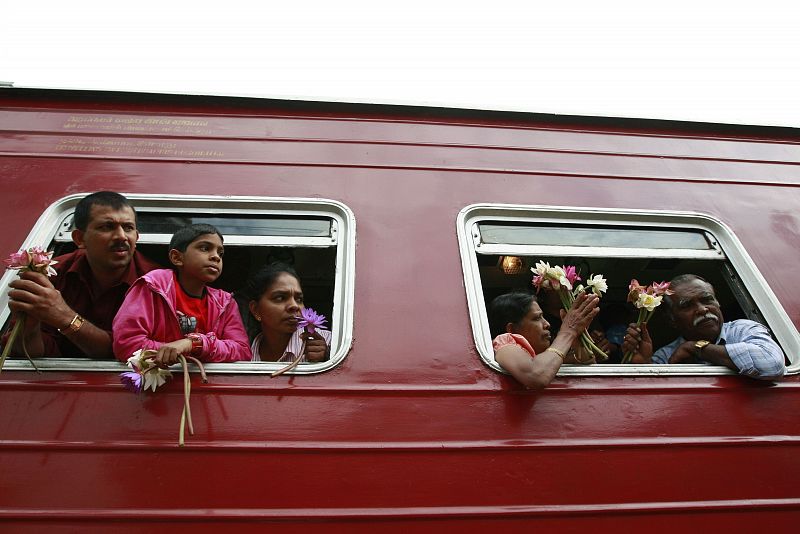 Tsunami survivors attend an anniversary held in remembrance of victims killed in the 2004 Asian tsunami in Peraliya, south of Colombo