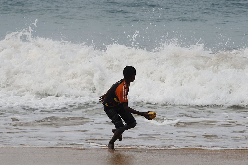 A boy plays on the beach in Peraliya, south of Colombo, on the anniversary of the 2004 Asian tsunami