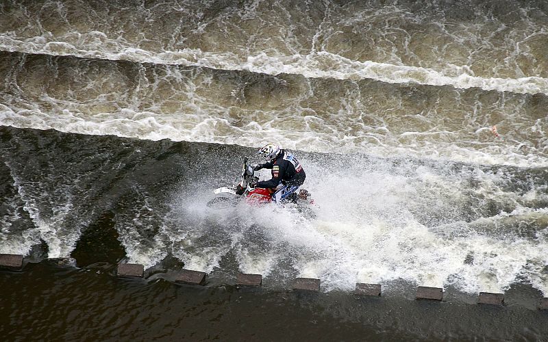 A competitor crosses a dam during the first stage of the third South American edition of the Dakar Rally 2011 from Victoria to Cordoba