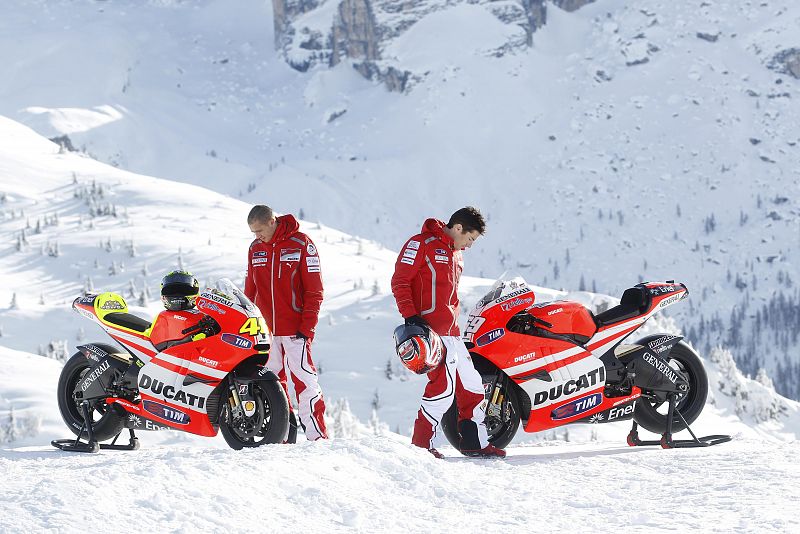 Ducati Moto GP rider Rossi and his teammate Hayden look at their bike Ducati GP 2011 during the "Wrooom, F1 and MotoGP Press Ski Meeting" in Madonna di Campiglio