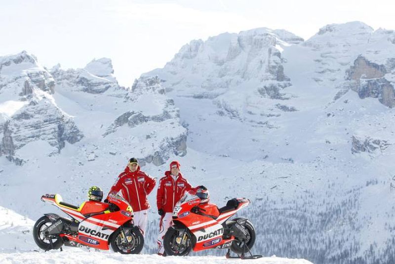 Ducati Moto GP rider Rossi and his teammate Hayden pose next to their bike Ducati GP 2011 during the "Wrooom, F1 and MotoGP Press Ski Meeting" in Madonna di Campiglio