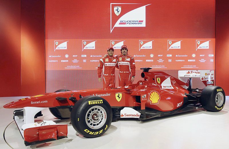 Ferrari's drivers Fernando Alonso of Spain and Felipe Massa of Brazil pose near the new Ferrari F150 Formula One car in Maranello