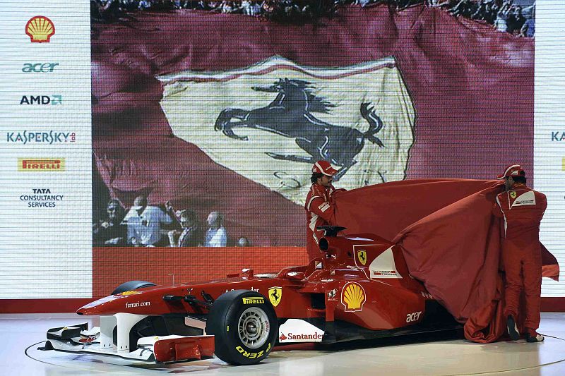 Ferrari's drivers Fernando Alonso of Spain and Felipe Massa of Brazil unveil the new Ferrari F150 Formula One car in Maranello