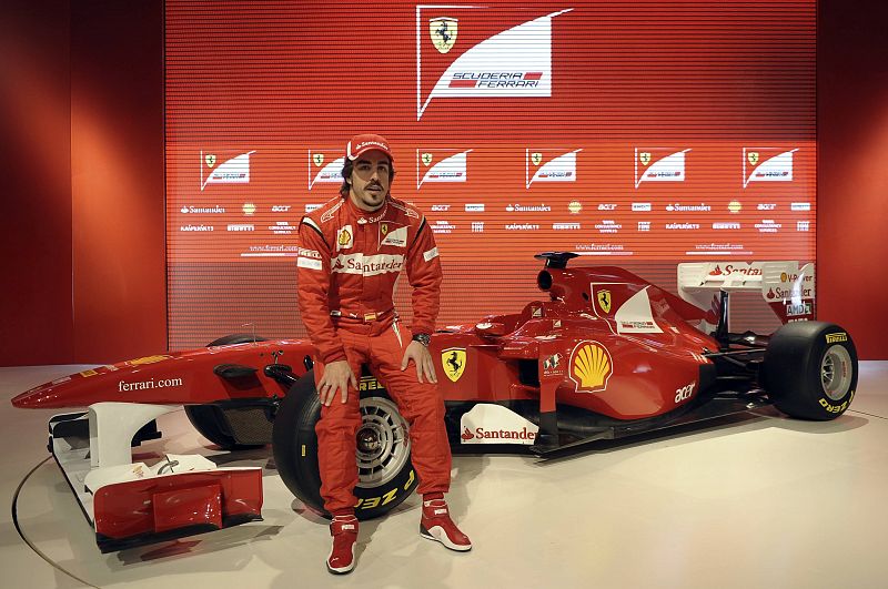 Ferrari's driver Fernando Alonso of Spain poses near the new Ferrari F150 Formula One car in Maranello