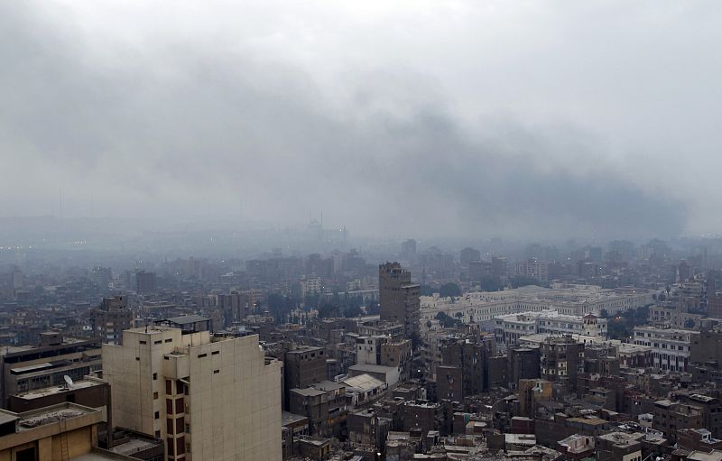 Smoke is seen above the city of Cairo after wide-spread protests