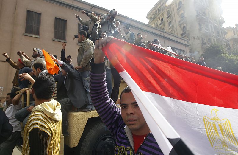 Protesters parade with Egyptian flags in Cairo