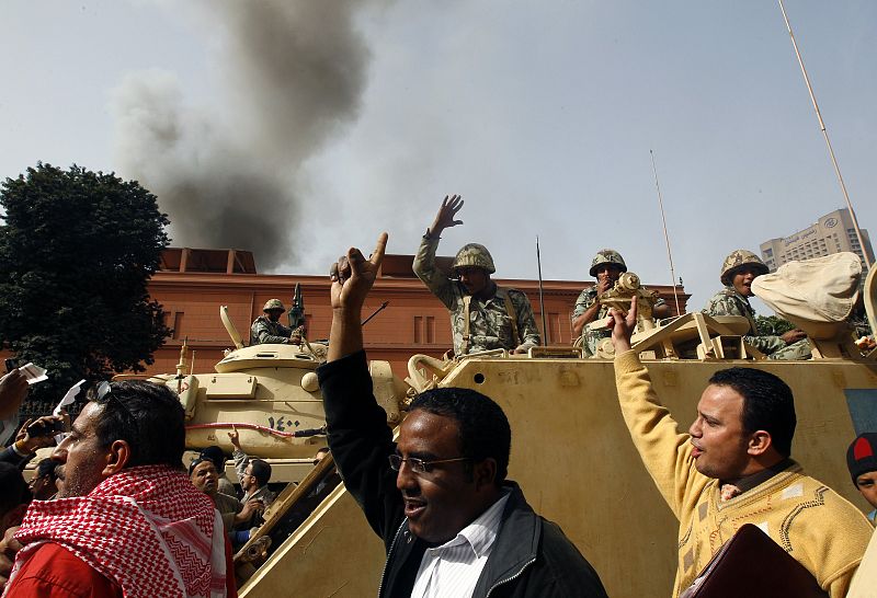 Protesters cheer for the army soldiers in central Cairo