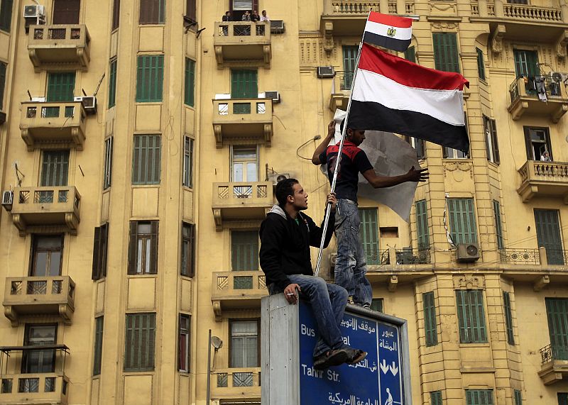 A protester holds an Egyptian flag during a protest in Cairo