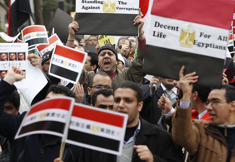 Egyptian residents in Japan shout slogans during a rally against Egypt's President Hosni Mubarak in Tokyo