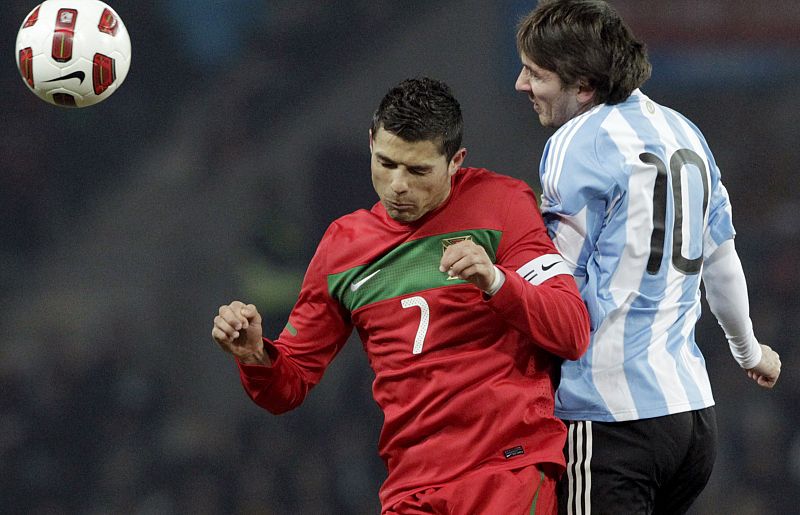 Portugal's Ronaldo fights for the ball with Argentina's Messi before their international friendly soccer match at the Stade de Geneve in Geneva