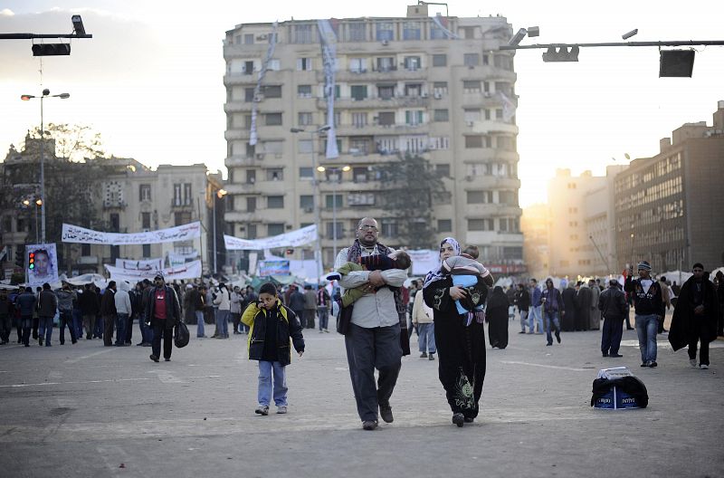 The sun rises on anti-government protesters as they collect their belongings and make their way out of Tahrir Square in Cairo