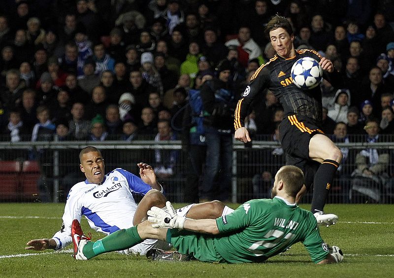 FC Copenhagen's goalkeeper Wiland challenges Chelsea's Torres during their Champions League soccer match at Parken stadium in Copenhagen