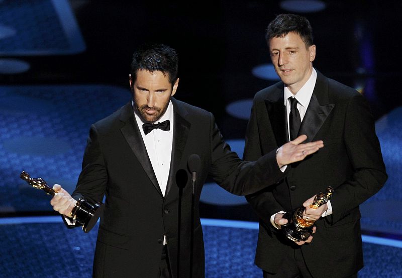 Trent Reznor and Atticus Ross accept the Oscar for best original score for "The Social Network" during the 83rd Academy Awards in Hollywood
