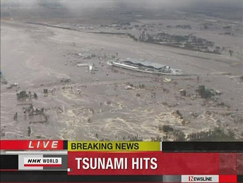 Frame grab of a tsunami engulfing Sendai airport