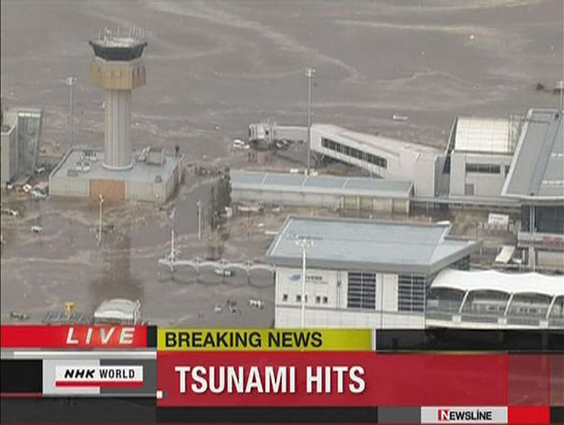 Frame grab of a tsunami engulfing Sendai airport