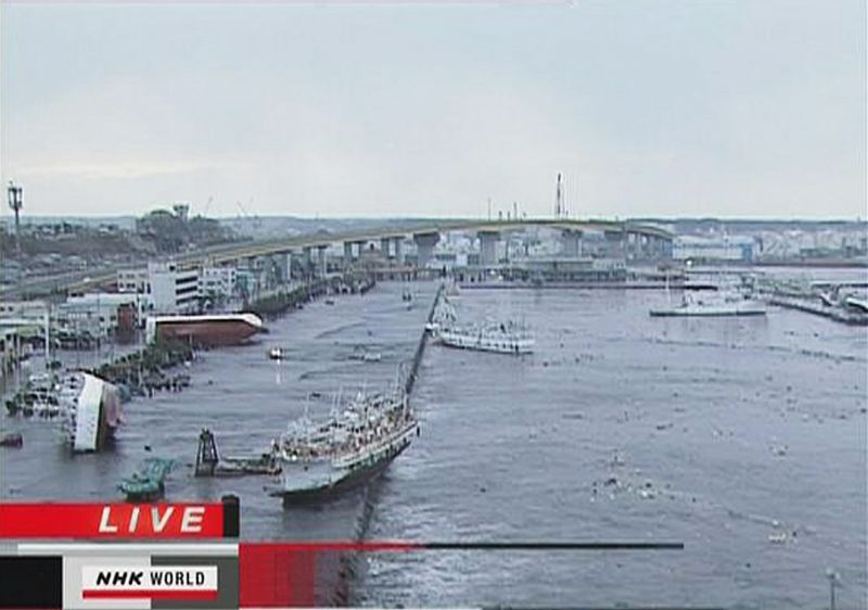 Frame grab of boats washed ashore following a tsunami in Hachinohe