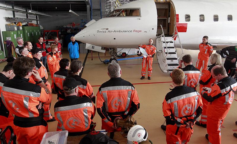 Jaggi, leader of a Swiss rescue team, gives a briefing before the team departs for Japan, at the Swiss Air Rescue base in Kloten