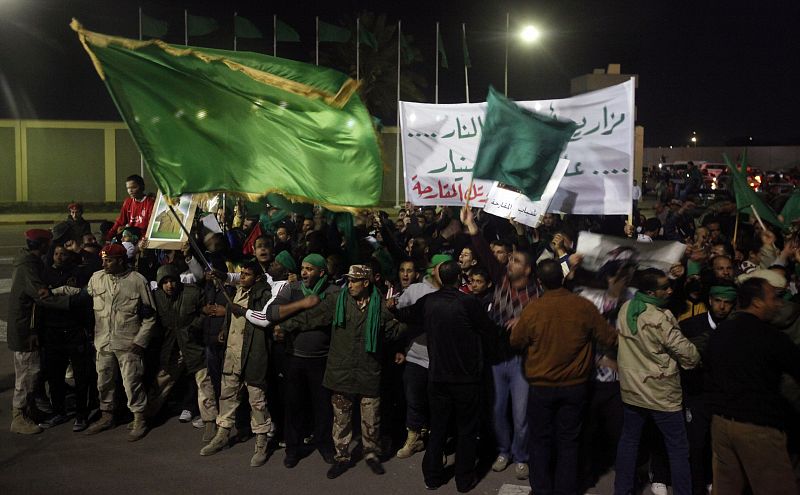 Supporters of Libya's leader Muammar Gaddafi shout slogans during a protest outside Bab Al-Aziziyah