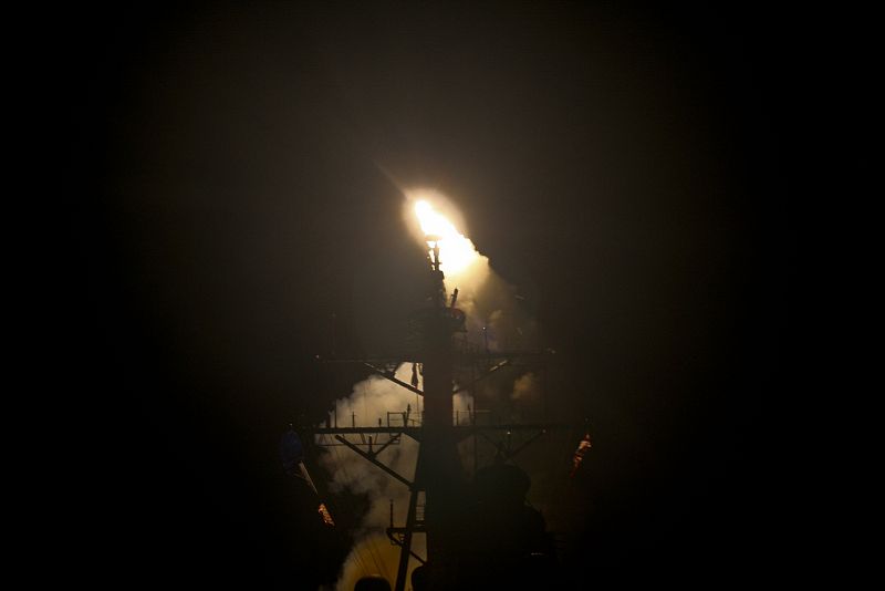 Arleigh Burke-class guided-missile destroyer USS Stout (DDG 55) launches a Tomahawk missile in support of Operation Odyssey Dawn in the Mediterranean Sea