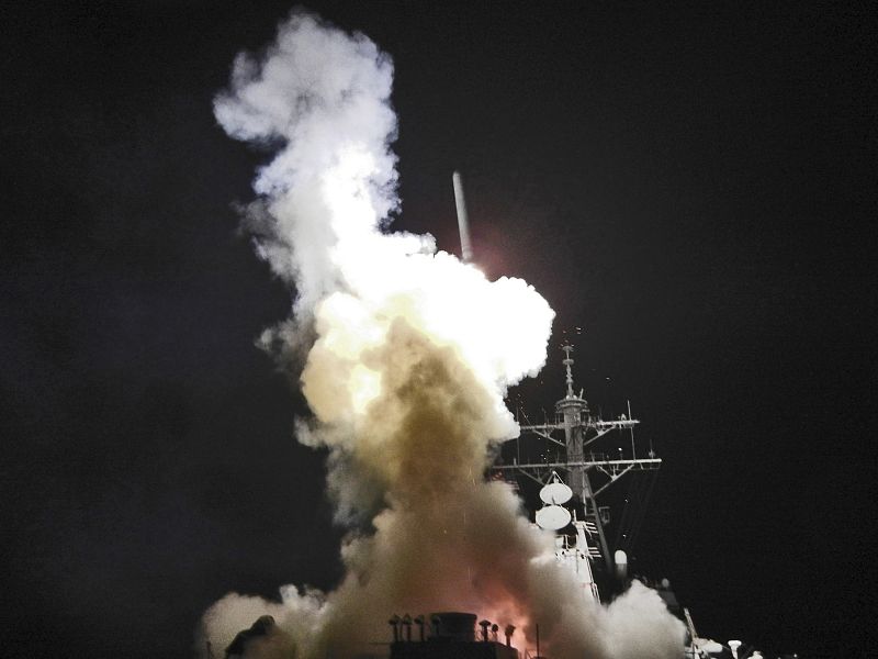 Arleigh Burke-class guided-missile destroyer USS Barry fires Tomahawk missile at Libya from Mediterranean Sea