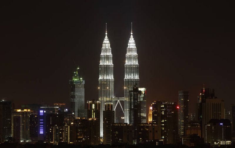 The Petronas Twin Towers in Kuala Lumpur are pictured before lights were turned off for Earth Hour