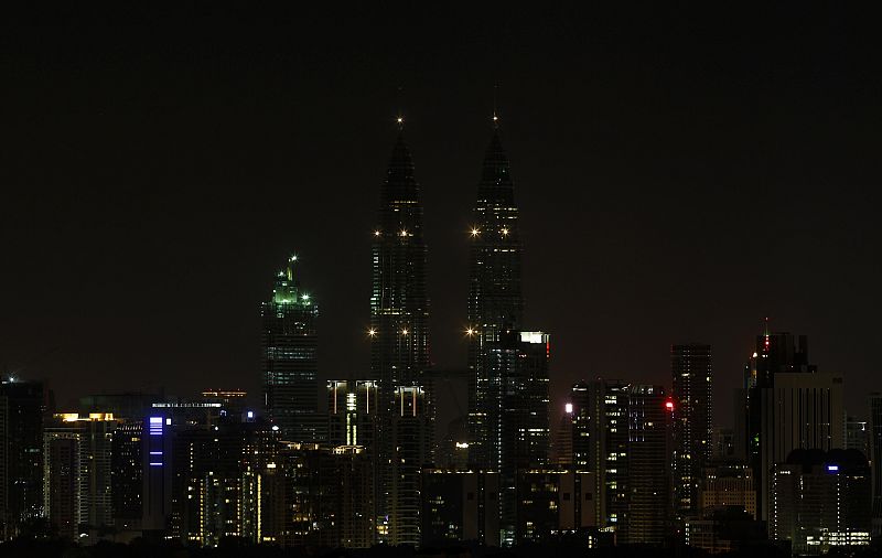 Petronas Twin Towers in Kuala Lumpur are pictured after lights were turned off for Earth Hour