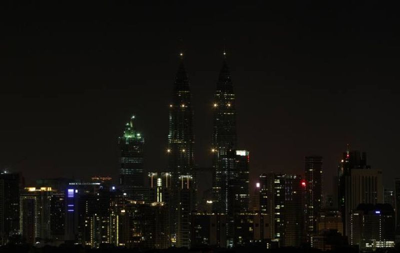 Petronas Twin Towers in Kuala Lumpur are pictured after lights were turned off for Earth Hour